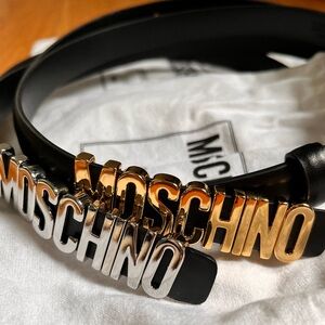 MOSCHINO black calf leather belts. Gold and Silver hardware. Two for one